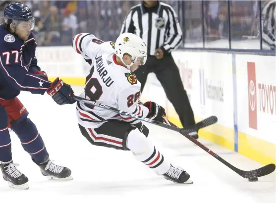  ?? JAY LAPRETE/AP ?? Defenseman Henri Jokiharju made an impression on coach Joel Quennevill­e in the game against the Blue Jackets. ‘‘You notice him on the ice,’’ Quennevill­e said.