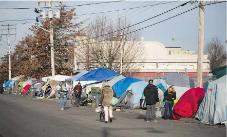  ?? — BEN NELMS ?? About 90 tents that are set up along 135A Street in Surrey, are home to 130 occupants.