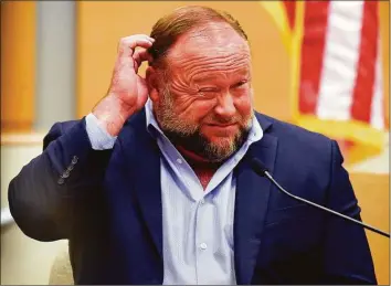  ?? Tyler Sizemore / Hearst Connecticu­t Media file photo ?? Infowars founder Alex Jones takes the witness stand to testify at the Sandy Hook defamation damages trial at state Superior Court in Waterbury in September.