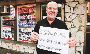  ?? AFP ?? The encouragin­g employment numbers are a welcome sign for small US business-owners like barber Rick Cook in Seattle, who had to close his shop as states imposed lockdowns.