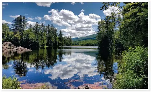  ??  ?? TIME FOR REFLECTION (top). Lefferts Pond, in the town of Chittenden, Vermont, is serenity and tranquilli­ty at its best.