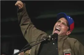  ??  ?? CARACAS: Venezuelan opposition leader Henrique Capriles speaks to supporters and reporters during a meeting in Caracas, Venezuela. — AP