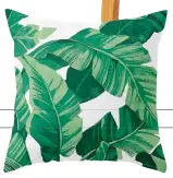  ??  ?? Tropical Banana Leaves IV cushion,
40cm sq, £23,
Catyarte at Society 6, society6.com.