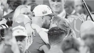  ?? KYLE TERADA USA TODAY Sports ?? Travis Kelce and Taylor Swift kiss after Kelce and the Kansas City Chiefs won Super Bowl LVIII against the San Francisco 49ers in Las Vegas on Feb. 11.