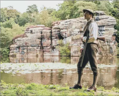  ?? PICTURE: GUZELIAN ?? HAVING A BLAST: Ben Wray recreating the moment when Reginald Farrer fired his shotgun to spread the seeds in the gorge.