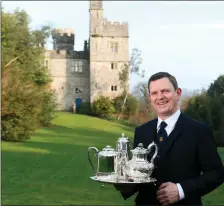  ?? Photo by Patrick Browne. ?? The Duke of Devonshire’s butler, Denis Nevin, with Lismore Castle in the background.
