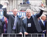  ?? Al Bello / TNS ?? New York Giants co-owners John Mara, left, and Steve Tisch celebrate during the New York Giants’ ticker tape victory parade down the Canyon of Heroes in New York in 2012. The free-falling Giants have been mismanaged from top down, according to Pat Leonard.