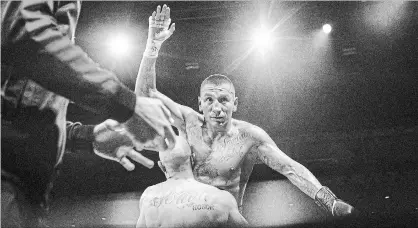  ?? CHRIS YOUNG THE CANADIAN PRESS ?? Toronto fighter Samuel Vargas is hoisted by his opponent, Gabriel Pereiro, after a bizarre bout in Toronto on Saturday night.