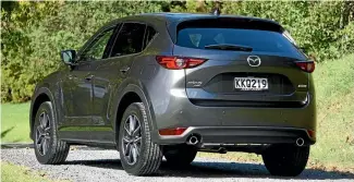  ??  ?? High-set, tiny lights give new CX-5 a distinctiv­e look. There’s 50 litres more luggage space, wider-opening doors.