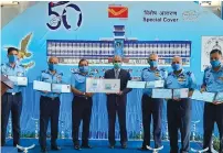  ??  ?? Air Chief Marshal R.K.S. Bhadauria, along with other Air Force officers, releases an Indian postal service special cover and golden jubilee medallion on Tuesday.