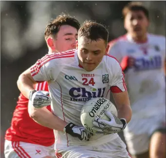  ??  ?? Stephen Sherlock of Cork in action against Fergal Donohue of Louth during the Allianz Football League Division 2 Round 3 match between Cork and Louth at Páirc Ui Rinn
Photo by Eóin Noonan/Sportsfile