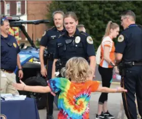  ??  ?? Kids did jumping jacks Wednesday during the Royersford Emergency Services Night to earn stickers and other prizes.