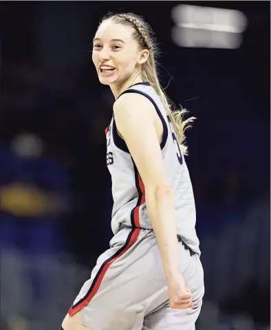  ?? Elsa / Getty Images ?? UConn’s Paige Bueckers celebrates her shot late in the fourth quarter against the Baylor Lady Bears during the Elite Eight round of the Women’s NCAA Tournament at the Alamodome on Monday in San Antonio, Texas.