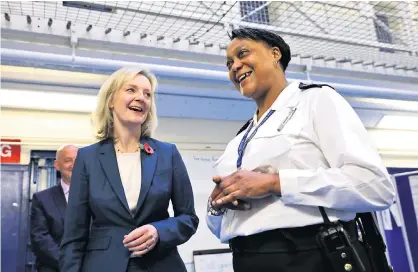  ??  ?? Trouble brewing: the Lord Chancellor Liz Truss meets custodial manager Wendy Fisher-McFarlane as she is escorted around HMP Brixton