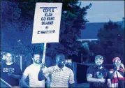  ?? CASEY TOTH / THE HERALD-SUN ?? Protesters gather at the old Durham County Courthouse on Monday in Durham, N.C. Durham County Sheriff Mike Andrews said some of the protesters who tore down the statue had been identified.