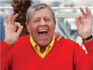  ??  ?? Jerry Lewis at the Cannes Film Festival in France in 2013, and below, with Dean Martin