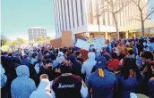  ??  ?? About 200 students and parents gathered at Albuquerqu­e Public Schools headquarte­rs Sunday to protest the school board’s decision to continue remote learning, which keeps sports off the table for now.