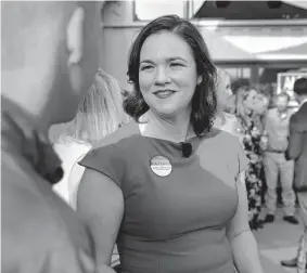  ?? Michael Wyke/Contributo­r ?? Alexandra del Moral Mealer, the GOP candidate for Harris County judge, talks with supporters at her watch party on May 24 in Houston.