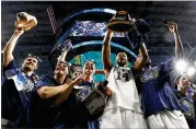  ?? RONALD MARTINEZ / GETTY IMAGES ?? Villanova players celebrate after defeating Michigan in Monday’s national championsh­ip game for the school’s second title in three years.