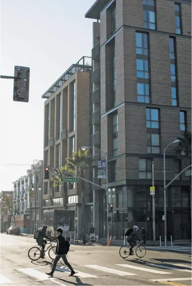  ?? Photos by Mason Trinca / Special to The Chronicle ?? Bill Sorro Community’s building at Sixth and Howard streets replaced a decrepit but beloved landmark.