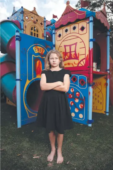  ?? Picture: BRENDAN RADKE ?? Chelsea Turnbull, 8, is upset that vandals trespassed and wreaked havoc in the backyard playground.
