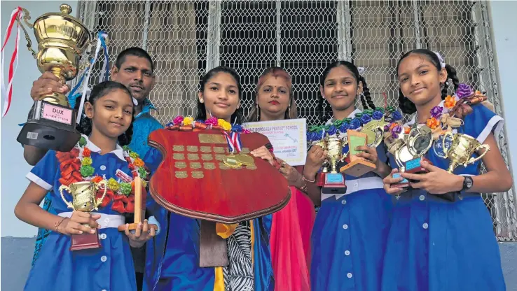  ?? Photo: Sheenam Chandra ?? From left: Kristi Karishma Singh, father, Ram Sudesh Singh, dux Kajol Kavita Singh, mother Devina Devi, Jaslyn Jessica Singh and Dipashna Diranjali Singh after the prizegivin­g ceremony at Koroqaqa Primary School in Naitasiri on November 10, 2018.