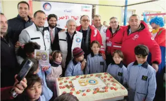  ?? — KUNA ?? KUWAIT: Kuwait Red Crescent Society’s Chairman Dr Hilal Al-Sayer participat­es in an activity oriented to Syrian refugees in Turkey.