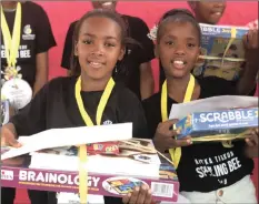  ?? | AFRIKA TIKKUN ?? UNATHI Mazwi and Ukwanda Swaartbooi of Cape Town, with their prizes for having been finalists in the recent Spelling Bee Championsh­ips.