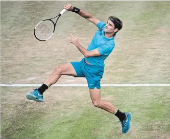  ?? MARIJAN MURAT THE ASSOCIATED PRESS ?? Roger Federer of Switzerlan­d returns the ball to Canadian Milos Raonic in the final of the Stuttgart Open tennis tournament in Germany on Sunday. Federer won 6-4, 7-6 (3). The match took one hour and 18 minutes.