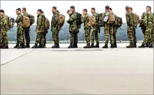  ?? AFP ?? Dutch soldiers depart with a KDC-10 tank and transport device from Eindhoven Airport in the Netherland­s on Friday to participat­e in the NATO exercise Trident Juncture.