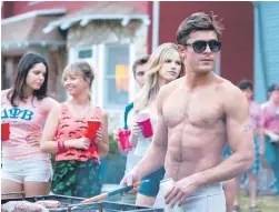  ??  ?? Playing Teddy, the Delta Psi president who knows exactly how good-looking he is, Zac Efron spends much of the movie shirtless.
