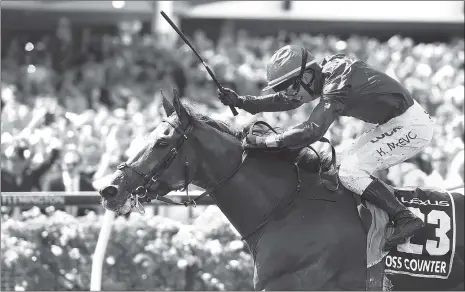  ?? Photo: VCG ?? Jockey Kerrin McEvoy celebrates with Cross Counter after winning the annual Melbourne Cup, the world’s richest two-mile handicap, at Flemington Racecourse in Melbourne, Australia on Tuesday.