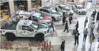  ??  ?? Dubai Police show off some of their patrol vehicles on the opening day of Dubai Motor Show