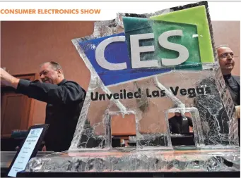  ?? ROBERT HANASHIRO, USA TODAY ?? Bartenders serve drinks from an ice sculpture at Mandalay Bay Resort & Casino in Las Vegas. About 3,800 companies have exhibits at CES, the world’s largest trade show.