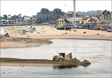  ?? DAN COYRO — SANTA CRUZ SENTINEL ?? The city of Santa Cruz has long relied on the use of heavy equipment to breach the San Lorenzo Lagoon to temporaril­y alleviate flooding that occurs when the lagoon’s water level rises. This year, work will begin to permanentl­y fix the issue.