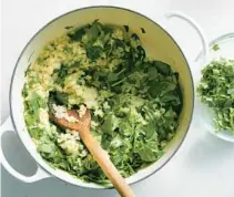  ?? ?? Spinach, scallions and cilantro add heft to a coconut milk-infused rice.