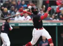  ?? TIM PHILLIS — THE NEWS-HERALD ?? A bundled-up Francisco Lindor takes a swing April 6 during the Indians’ 3-2 win over the Royals in their home opener at Progressiv­e Field.