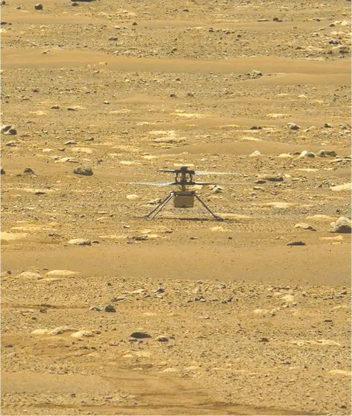  ?? HANDOUT/NASA/JPL-CALTECH/MSSS/ASU/AFP VIA GETTY IMAGES ?? NASA’S Ingenuity Mars Helicopter is caught by cameras aboard NASA’S Perseveran­ce Mars rover
after its first flight Monday, marking the first powered, controlled flight on another planet.