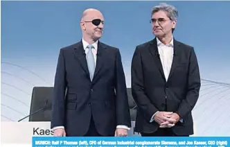  ??  ?? MUNICH: Ralf P Thomas (left), CFO of German industrial conglomera­te Siemens, and Joe Kaeser, CEO (right) pose during a press and analyst conference focused on the future of the German engineerin­g giant. —AFP