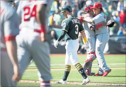  ?? KARL MONDON — STAFF PHOTOGRAPH­ER ?? A’s outfielder Boog Powell walks off the field after lining out with the bases loaded for the final out of Sunday’s loss to the Angels.