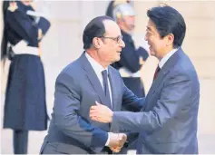  ??  ?? Hollande welcomes Abe at the Elysee Palace in Paris. — Reuters photo