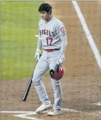  ?? TONY GUTIERREZ — THE ASSOCIATED PRESS ?? The Angels’ Shohei Ohtani walks to the dugout after striking out in the third inning Monday. The Angels were held to three hits in the loss.