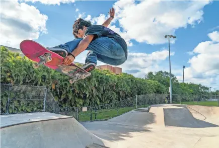  ?? PHOTOS BY GREG LOVETT/PALM BEACH POST ?? Kevin Gurdian rides his board at the skatepark in Plant Drive Park on April 17 in Palm Beach Gardens.