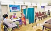  ??  ?? A health worker prepares to administer the second dose of a Covid-19 vaccine at a hospital in Daryaganj.