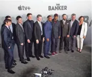  ?? MAX GERSH / THE COMMERCIAL APPEAL ?? People with “The Banker” stop for a photo as they walk in to the premiere Monday at the National Civil Rights Museum in Memphis.