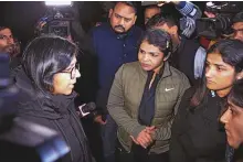  ?? ANI ?? Delhi Commission for Women chairperso­n Swati Maliwal meets wrestlers Vinesh Phogat, Sakshee Malikkh and Anshu Malik at Jantar Mantar in Delhi on Wednesday. ■