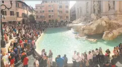  ?? Joe Amarante / Hearst CT Media ?? Trevi Fountain in Rome is mobbed in 2018. University of New Haven professor Jan Louise Jones, below, says for sustainabl­e travel, businesses need to better coordinate to prevent such daily overcrowdi­ng.