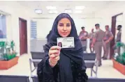  ?? [SAUDI INFORMATIO­N MINISTRY VIA THE ASSOCIATED PRESS] ?? Esraa Albuti, an executive director at Ernst & Young, displays her new driving license Monday at the General Department of Traffic in Riyadh.