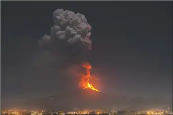  ??  ?? Flames and smoke tower over the city of Pedara, Sicily.