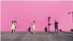  ??  ?? CHRISTOPHE­R Bailer, Dominique Druckman and Wylie Heiner take selfies outside LA’S most famous selfie location – The Pink Wall, a bright pink-painted wall on the side of a clothing store building. | HBO Max